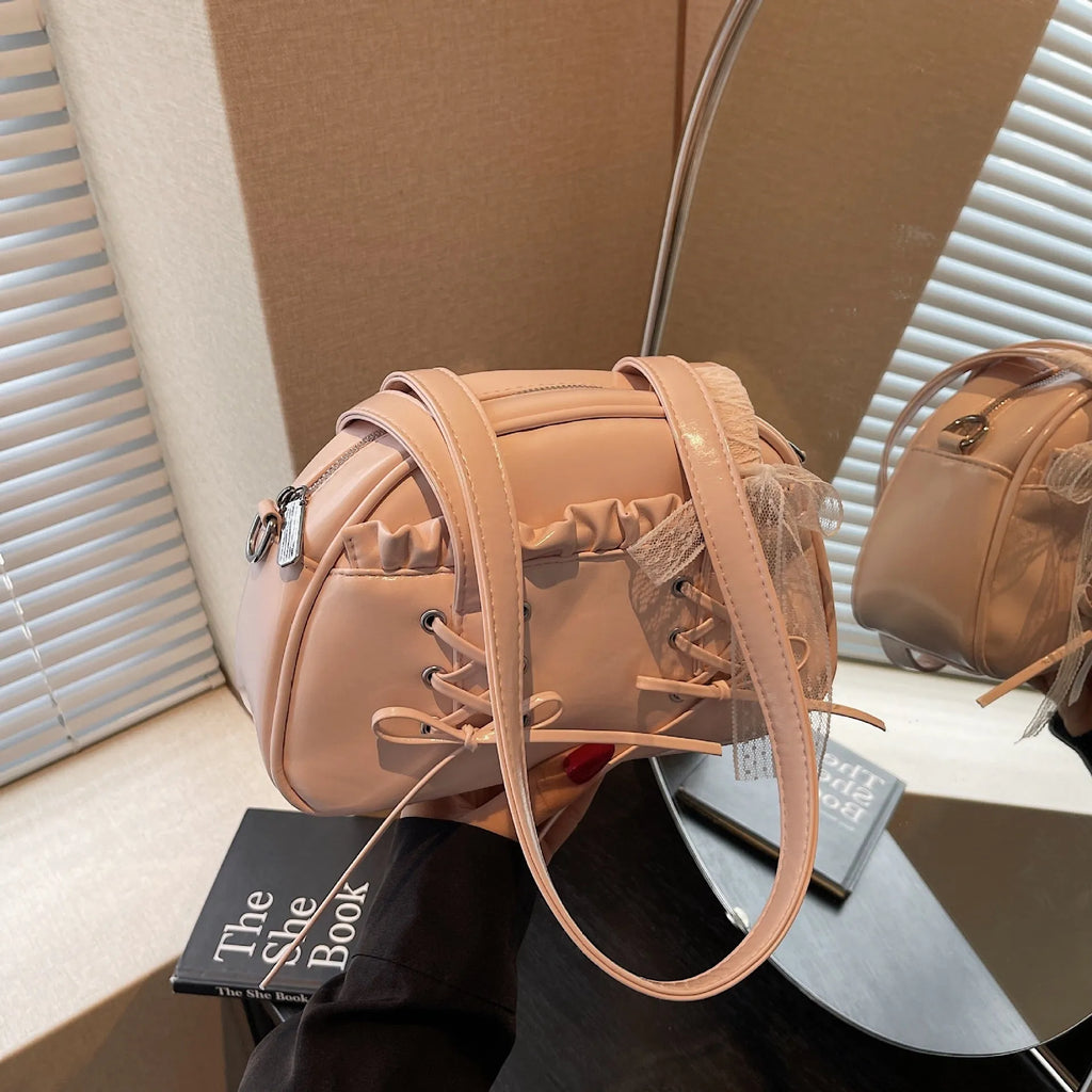 Women's casual PU leather handbag with a bandage bow decoration on the front.