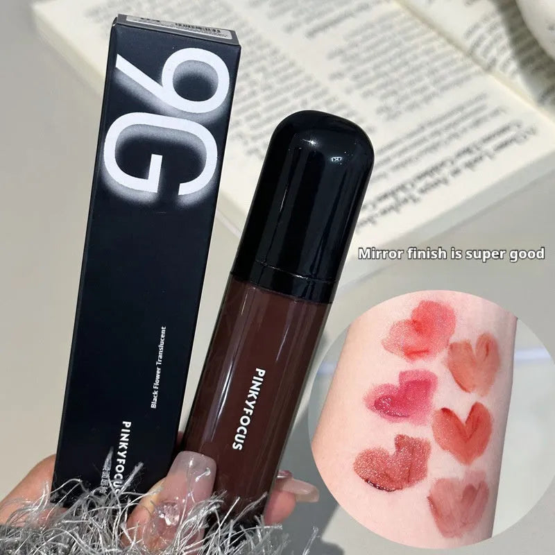 Black Shiny Mirror Lip Lacquer tube showing six deep colour shades: Black Tomato, Orange Brown, Bean Paste, Rose, And Red, and Sweet Potato.