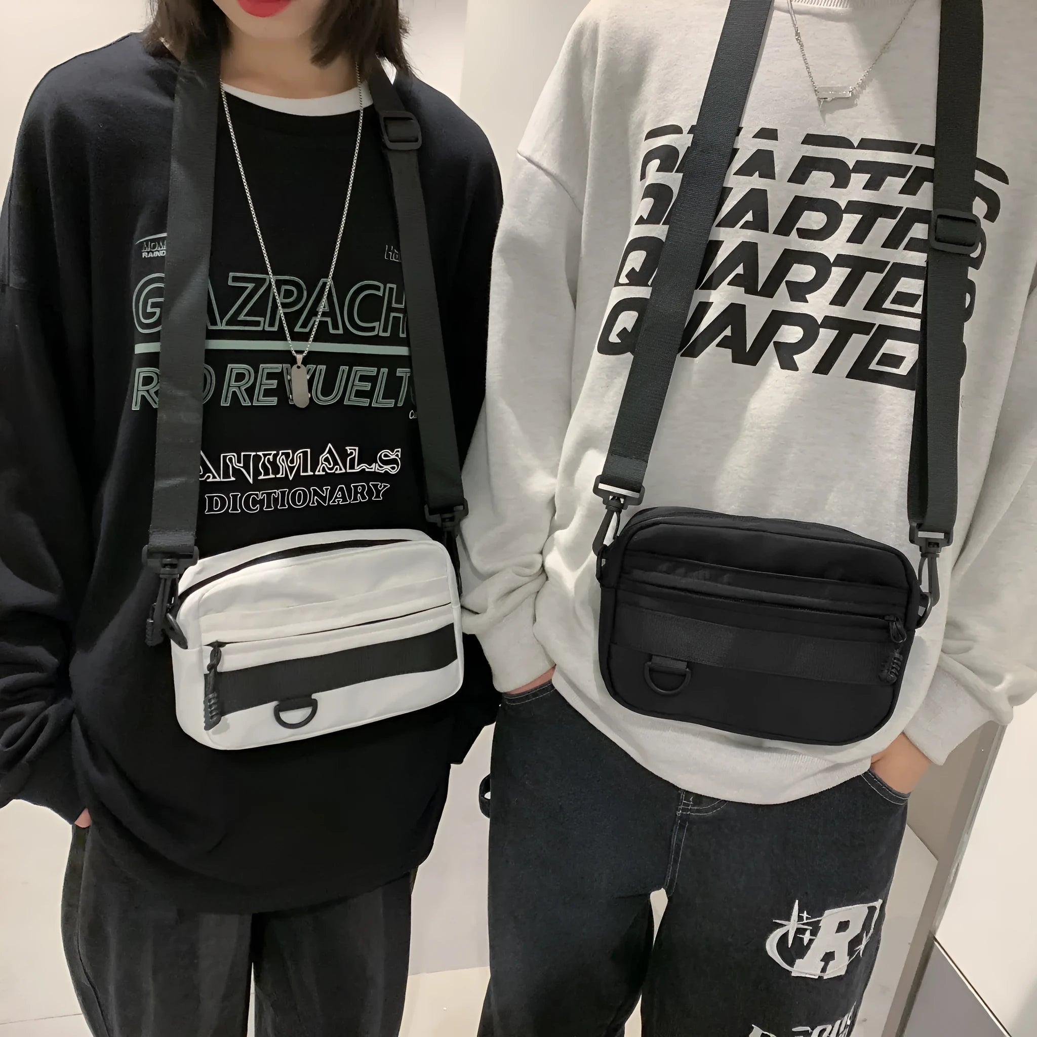 Men's black crossbody messenger bag with visible sewing thread details, shown with dimensions of 22cm length