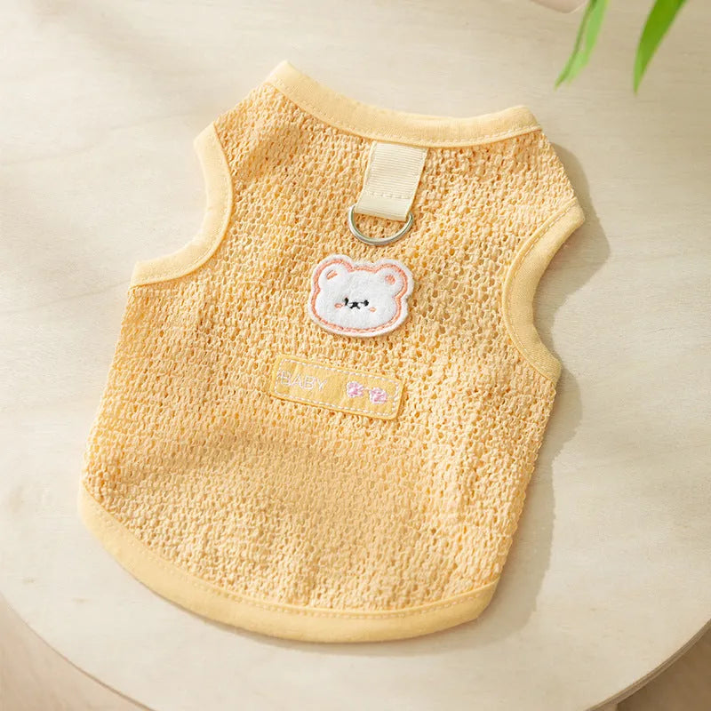 Green knitted cat clothing with a bear patch and breathable hollowed-out design on a cat model.