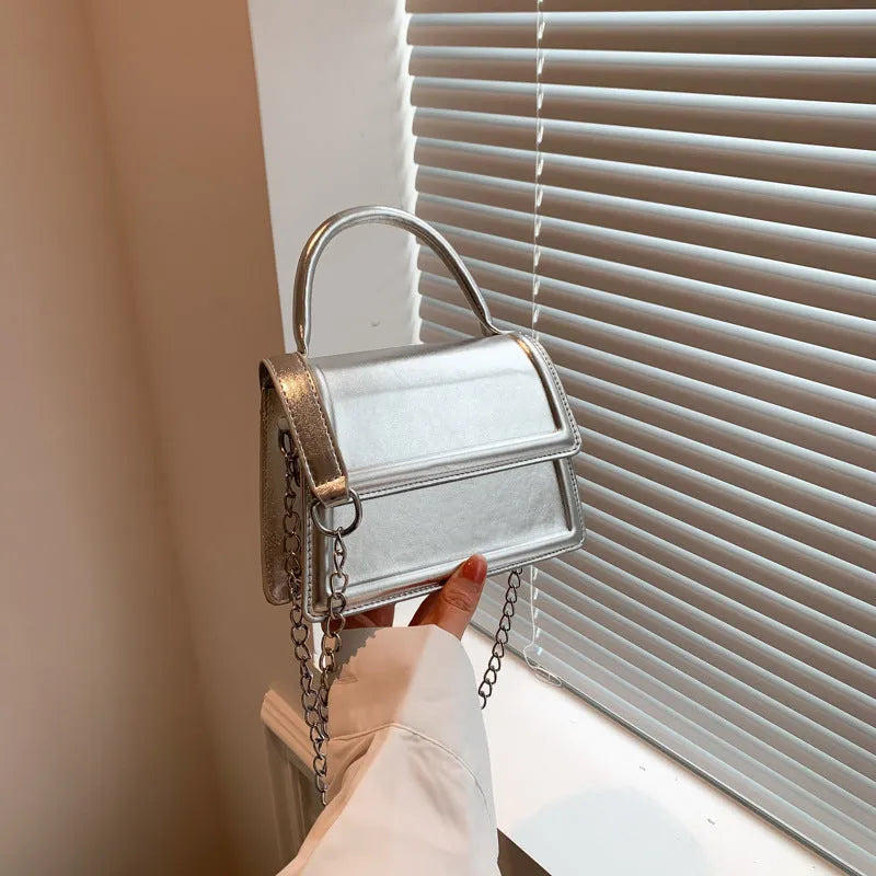 Square-shaped PU leather crossbody bag in multiple colour options on a model.