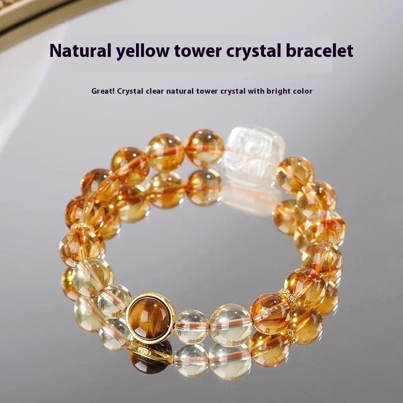 Women's ethnic style bracelet with a carved 10mm citrine crystal geometry bead.