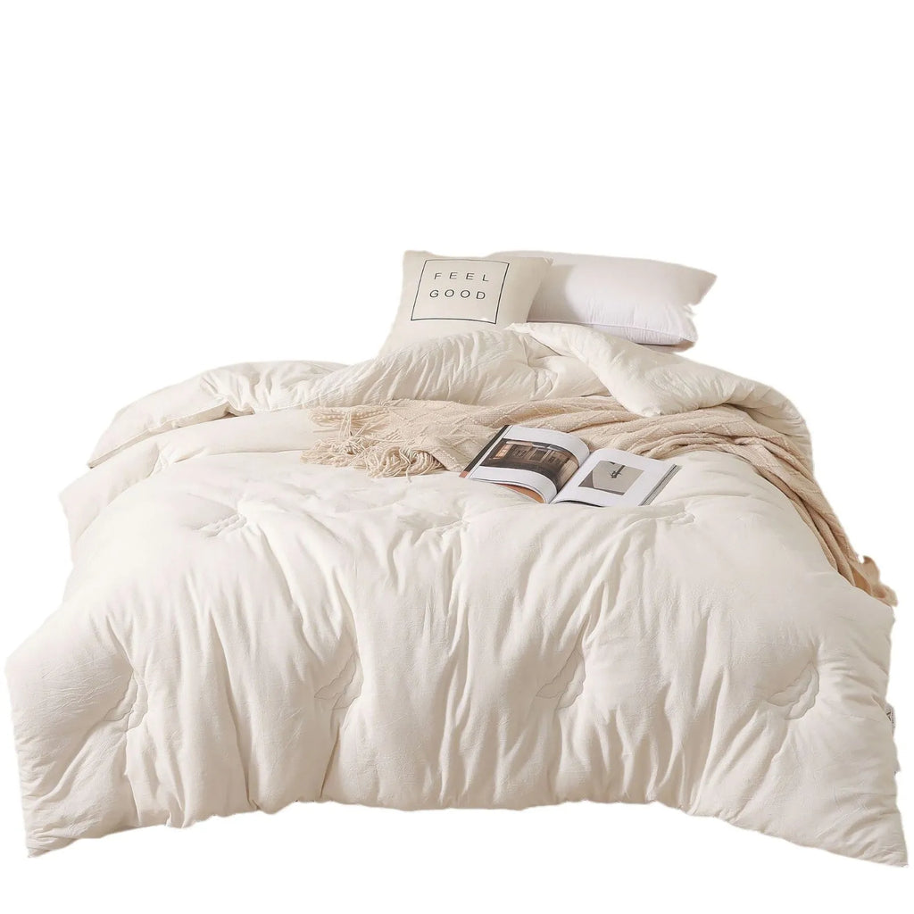 Soybean fibre filled pure cotton quilt in grey, shown on a bed in a 150x200cm size.