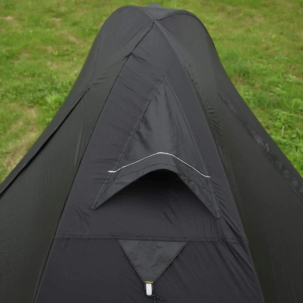 Single person red tent with aluminium poles, shown pitched in a forest
