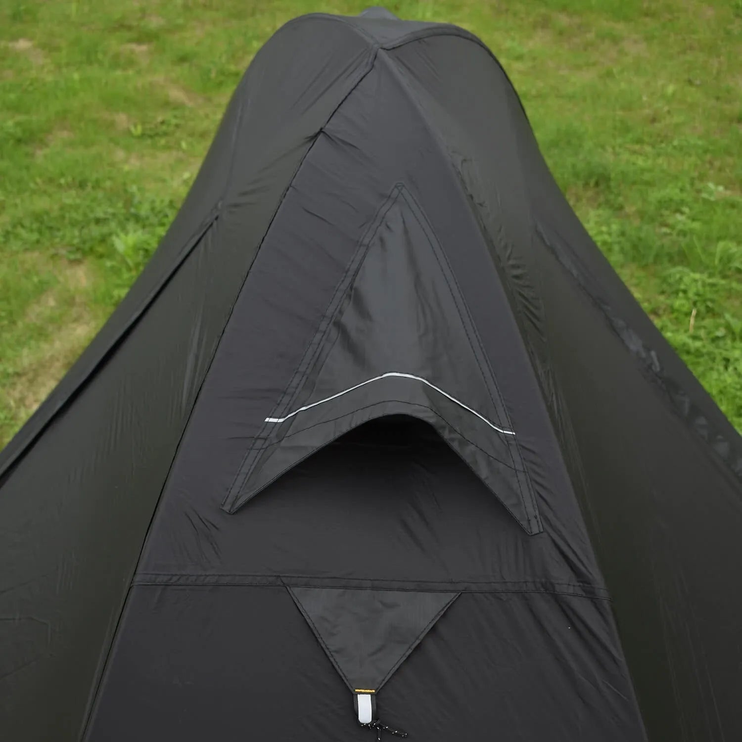 Single person red tent with aluminium poles, shown pitched in a forest
