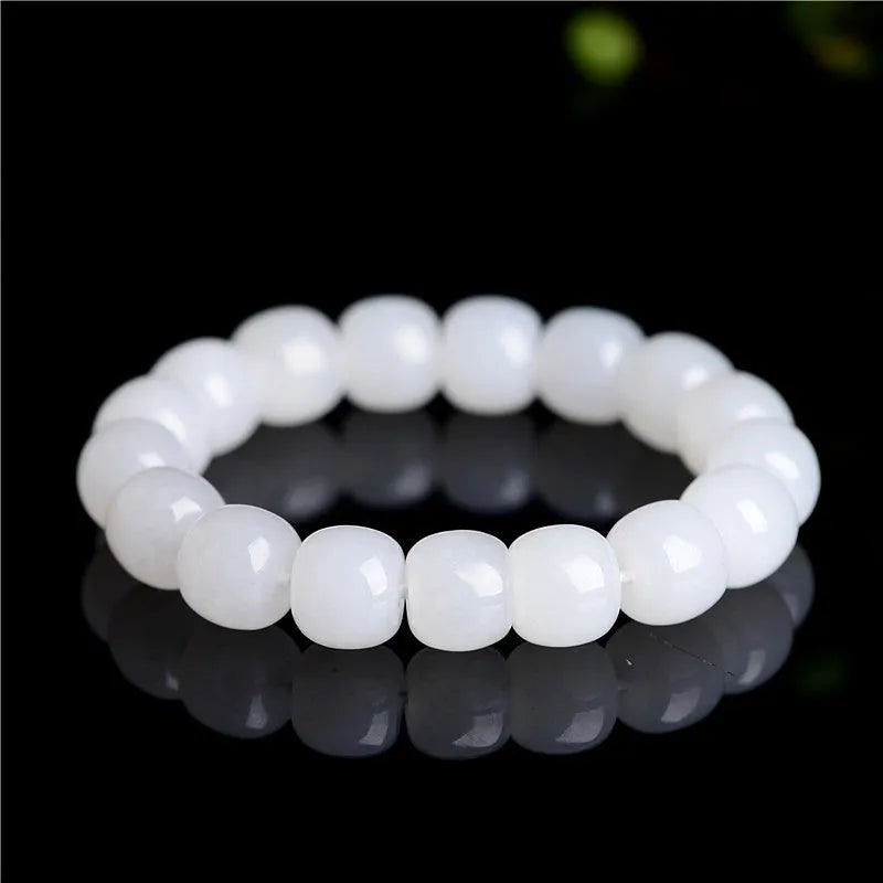 White Hetian jade barrel bead bracelet showing three bead size options on wrist