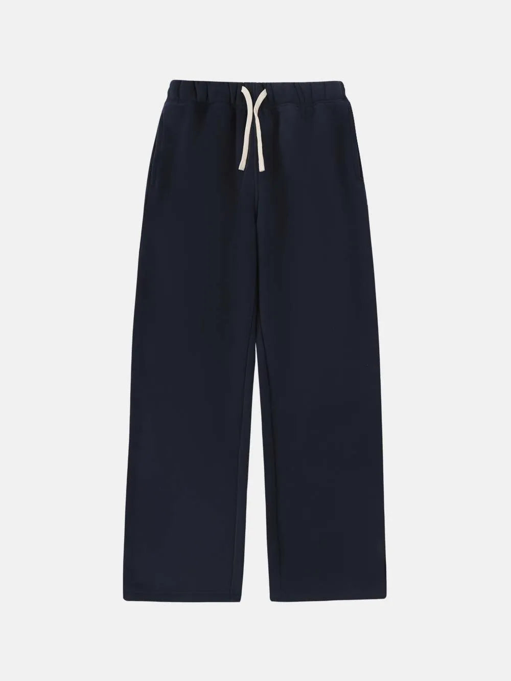 Man wearing loose fit grey fleece-lined sweatpants with an elastic drawstring waist.