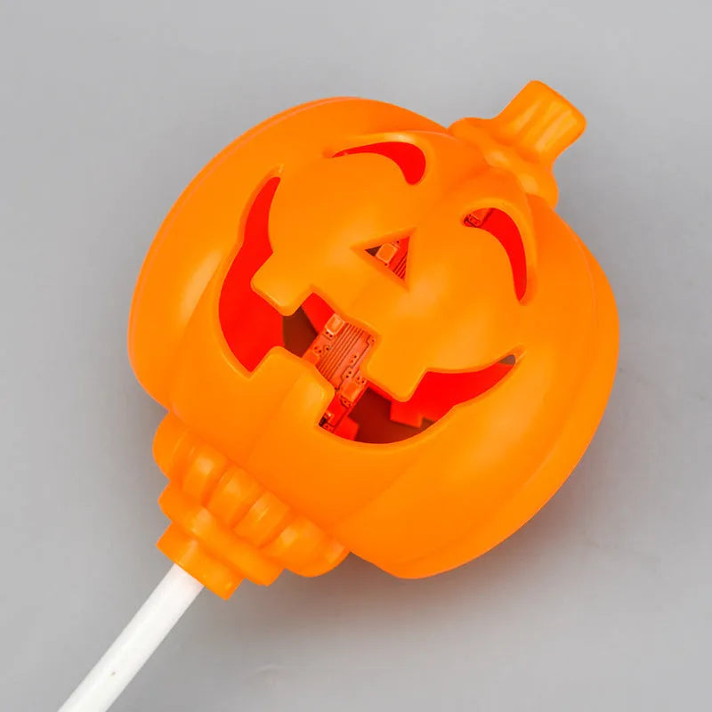 Plastic pumpkin-shaped decorative lamp with purple or yellow light, standing 22cm tall.