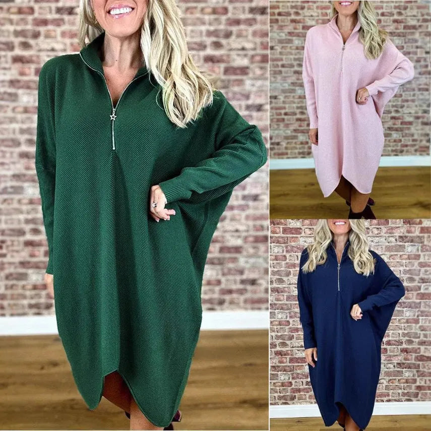 Women's solid colour knitted loose dress with front zip and raglan sleeves.