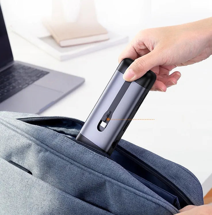 USB-C to multi-port dock expansion adapter showing HDMI, USB 3.0, PD charging, VGA, and Ethernet ports.