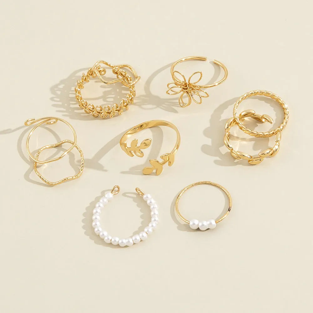 Gold colour openwork flower ring with electroplated glossy finish and floral design