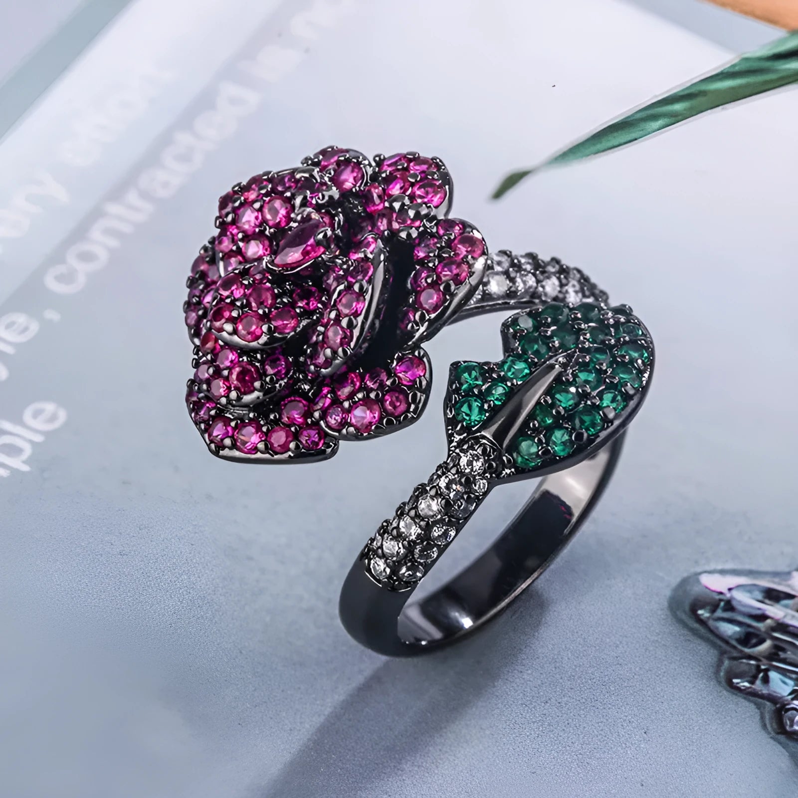 Gold-plated black gold flower personality ring with simulated red corundum stones