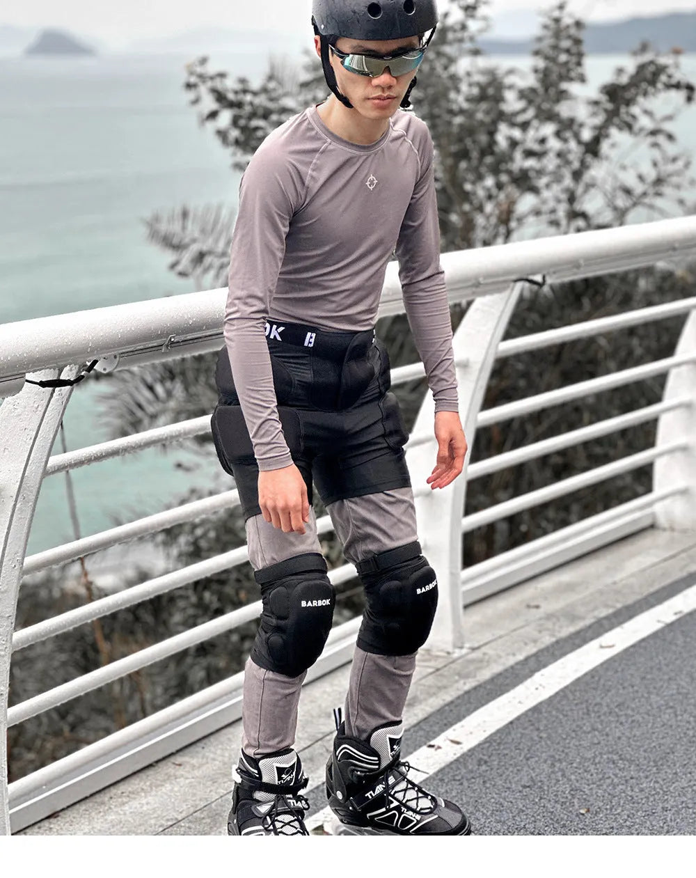 Black adult hip protection pants with NBR foam padding for roller skating and skateboarding