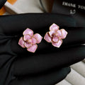 Gold plated purple oil-spot glaze flower stud earrings with copper construction and fresh floral design