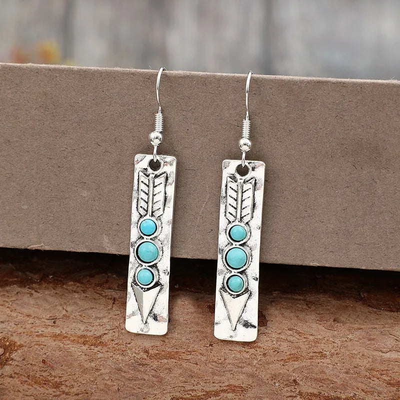 Silver geometric long strip earrings with turquoise inlay detailing and retro styling