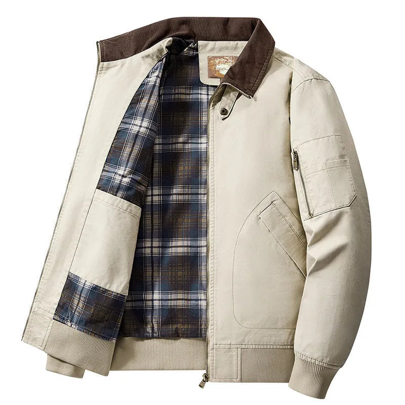 Men's beige washed cotton flight jacket on a hanger, showing its simple design and cotton fabric texture.