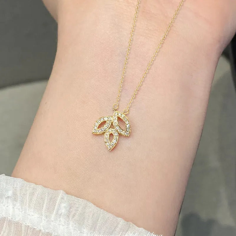 Women's yellow gold copper hollow leaf horse eye pendant necklace with inlaid zircon on adjustable O-ring chain