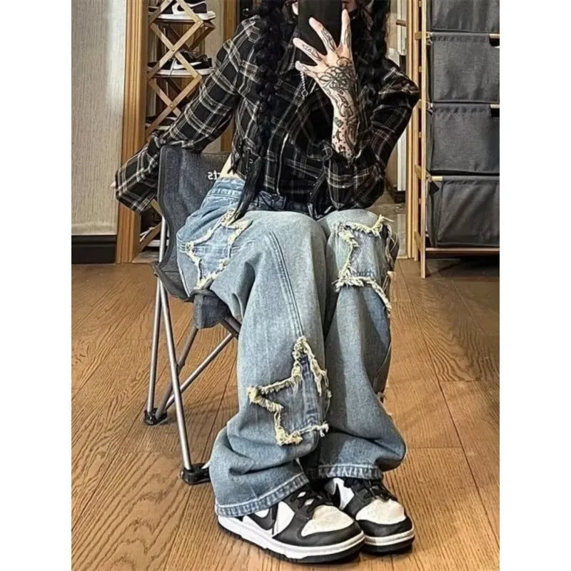 Blue high waist women's denim trousers with a straight wide-leg cut on a size chart.