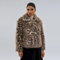 Women's leopard print coat with buckle lapel closure showing regular sleeves and normal length