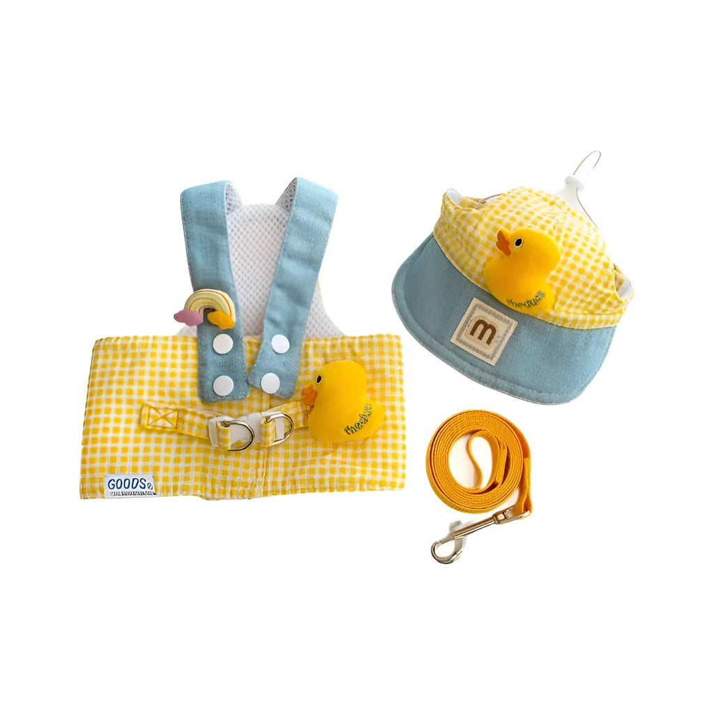 Pet dog harness and leash set with a cute animal hat and a blue tug rope on a green background.