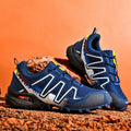Men's grey and orange casual shoe with synthetic leather upper and non-slip rubber sole.