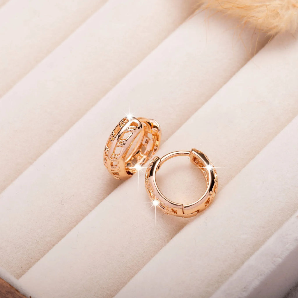 Copper earrings with rose gold finish featuring hollowed-out leaf and heart shapes