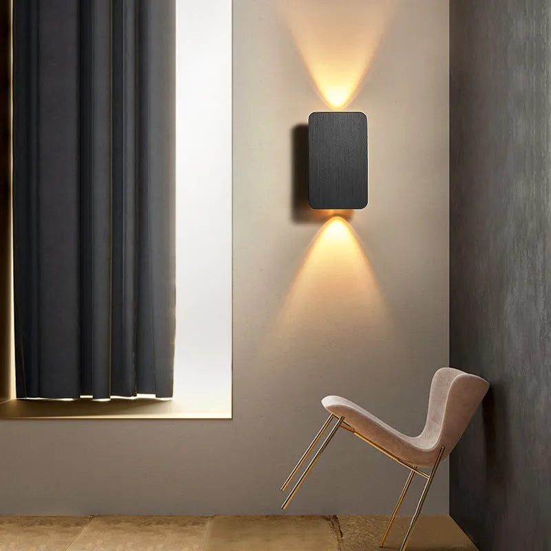 Minimalist Nordic-style LED wall lamp in black finish mounted on wall showing adjustable light settings