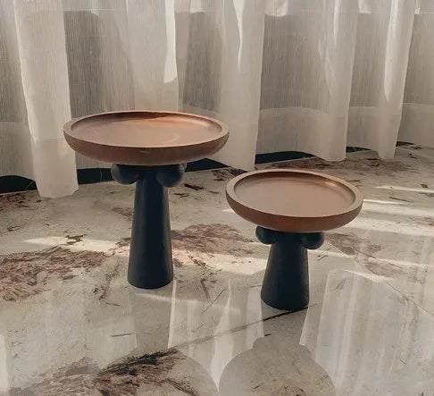 Nordic high-legged wooden round tray displaying candles and perfume bottles