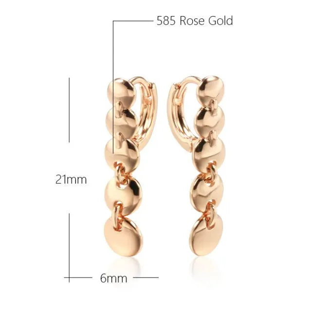 Long gold retro hoop earrings with woven copper texture, shown as a pair.