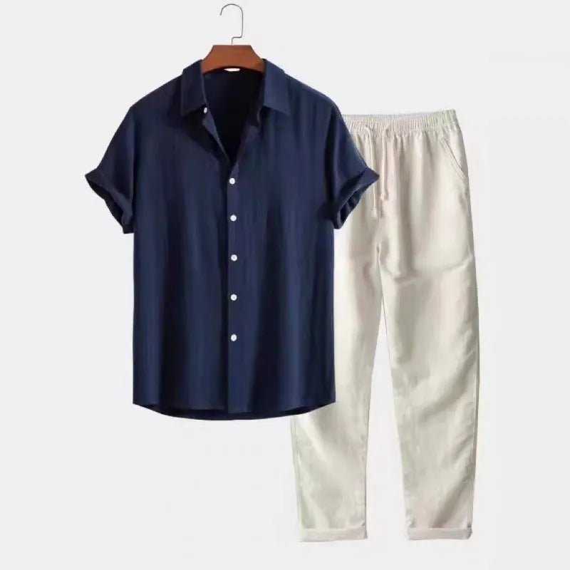 Man wearing a loose casual short-sleeve linen-look shirt and matching trousers in a solid colour.