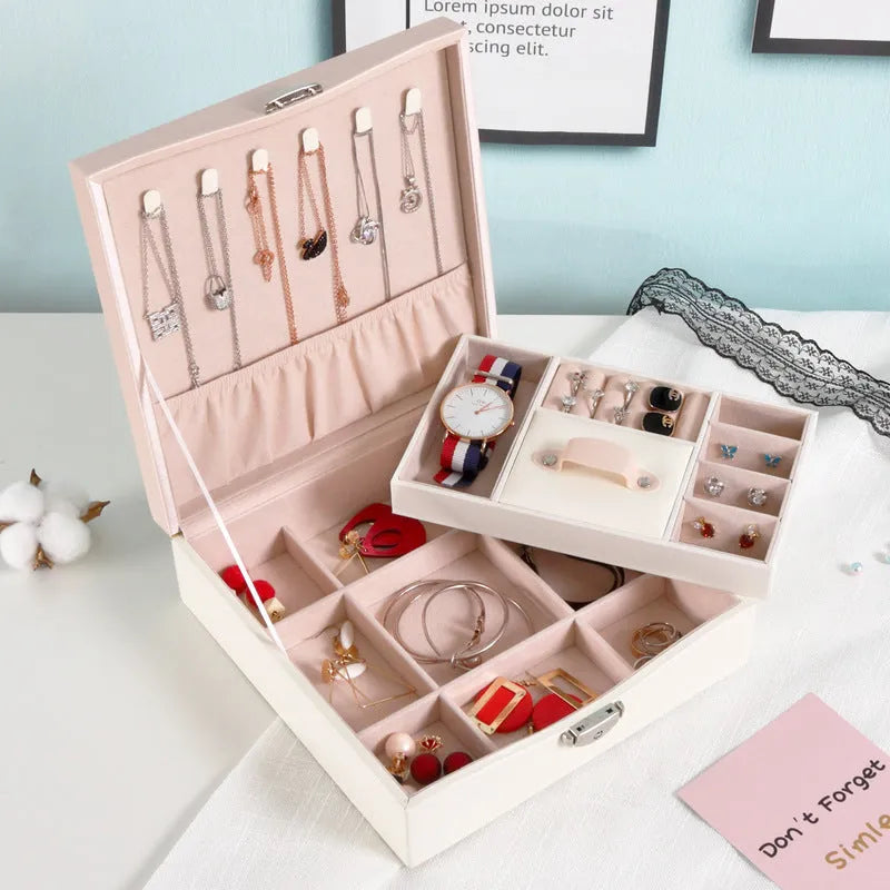 Red jewellery storage box with separate compartments for necklaces and rings