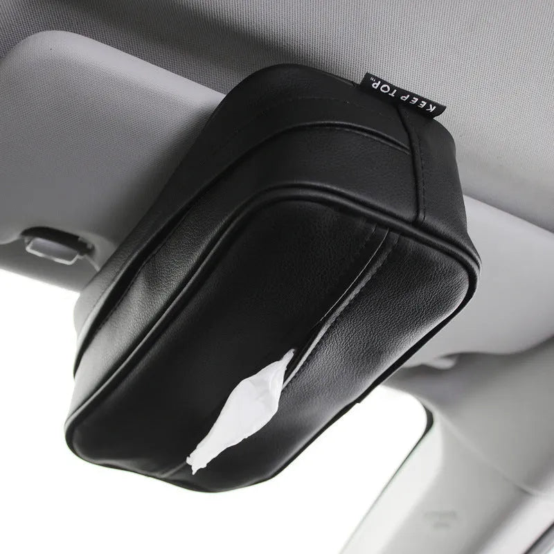 Black PU leather hanging storage box with paper bag liner, shown suspended.