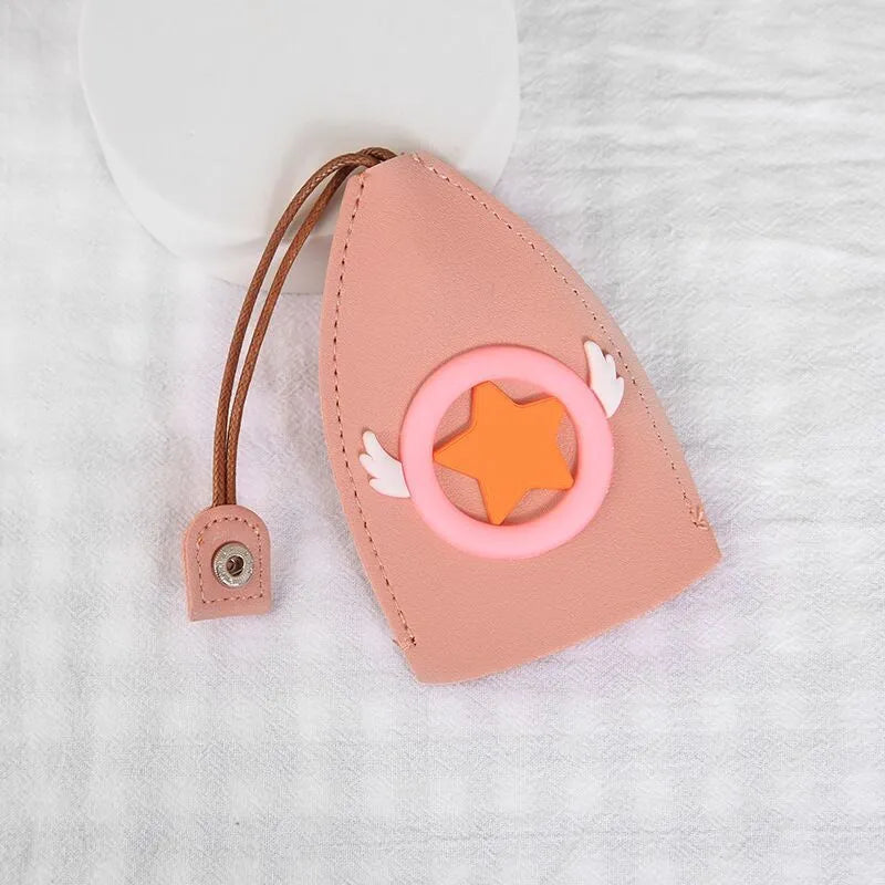 Colourful cartoon pull-out key protector case made from PU leather, showing a selection of fruit and animal designs.