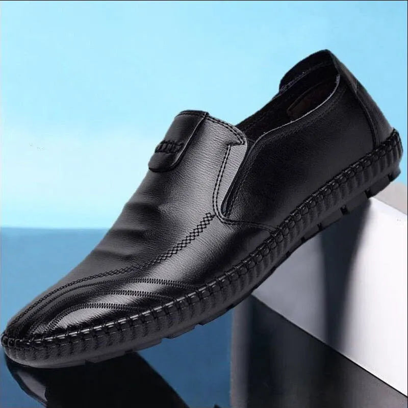Men's black and brown leather business shoes with flat heel and plain toe.