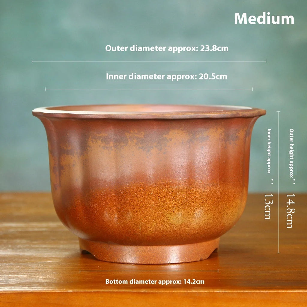 Indoor antique carved purple sand ceramic bonsai pot in classical style with wood burning finish.