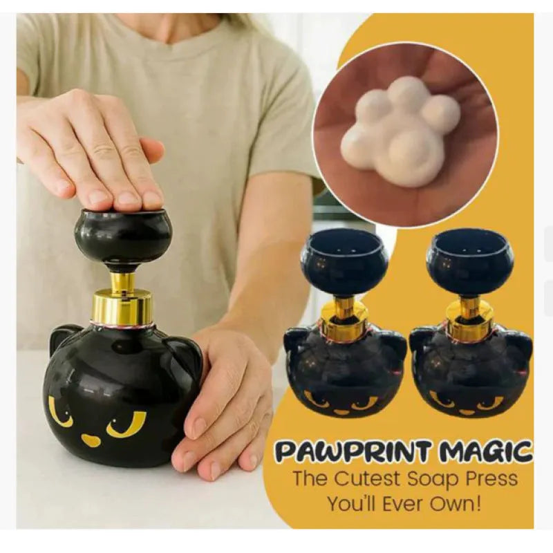 Black cartoon cat-shaped plastic foam soap dispenser, 10cm wide by 18cm tall.
