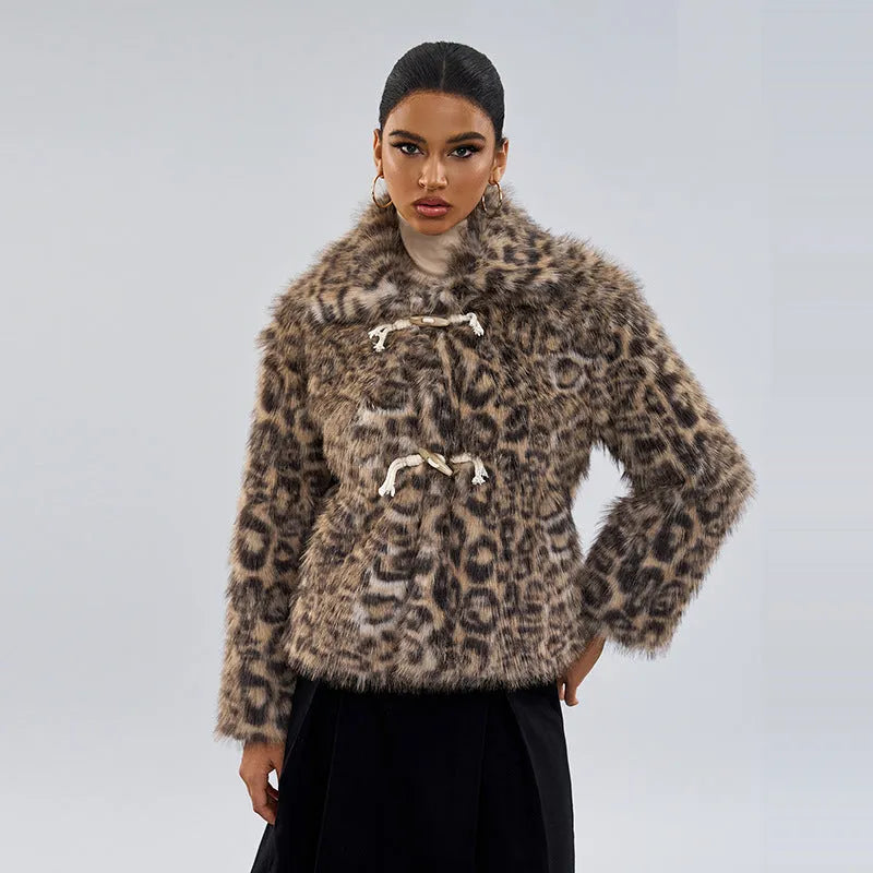 Women's leopard print coat with buckle lapel closure showing regular sleeves and normal length