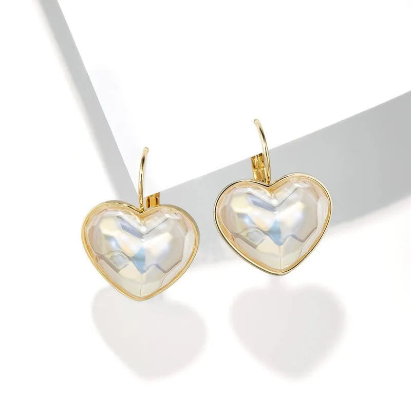 Gold colour clip-on earrings for women with metal alloy construction and natural summer style design