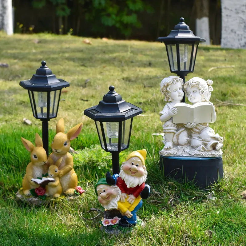 Solar powered decorative garden lamp with synthetic resin animal sculpture design