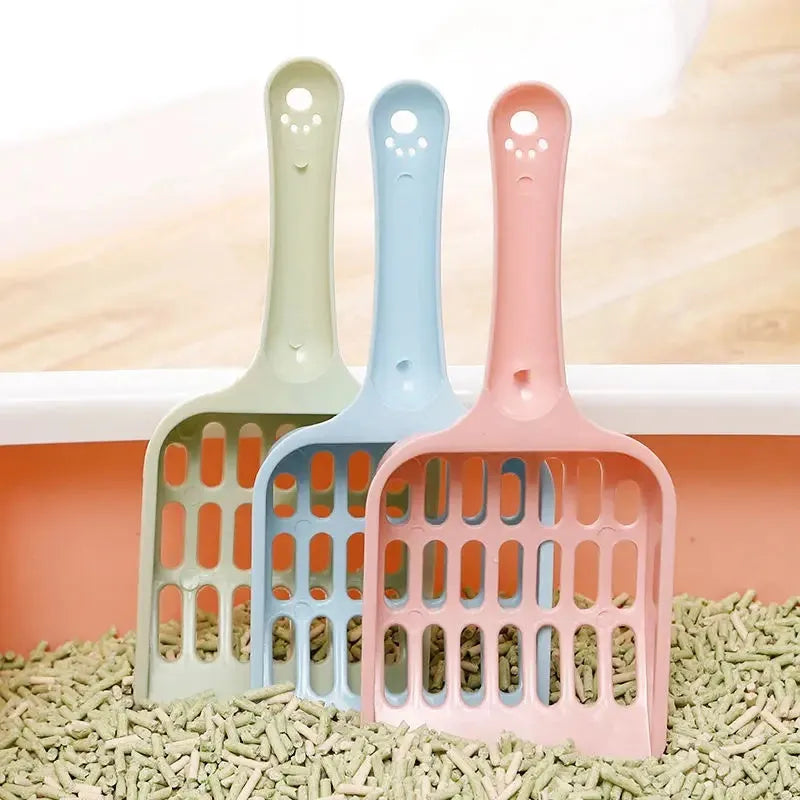 Blue plastic cat litter scoop tool on a white background.