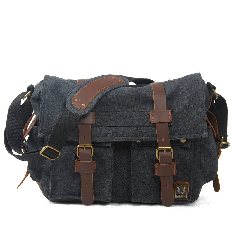 Men's canvas crossbody shoulder bag with cowhide trim showing internal organisers
