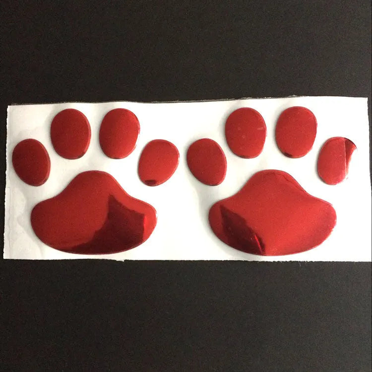 Pair of hand-shaped dog footprint car stickers in four colour options, each 7 cm long.