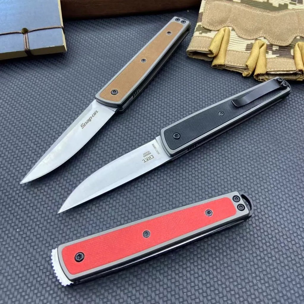 Folding fruit knife with stainless steel blade shown in open position with measurements