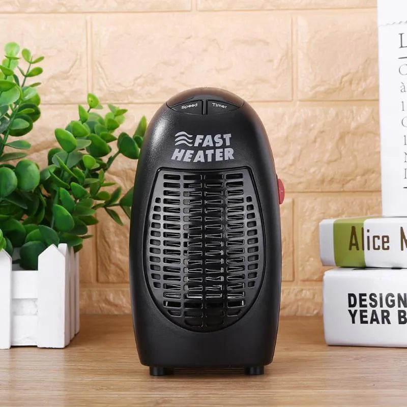 Small black portable ceramic electric heater with digital display on a white background