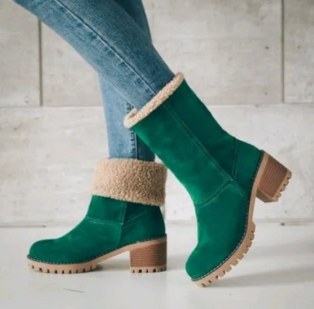 Women's black suede mid-tube snow boots with a round toe and thick low heel on a waterproof platform.