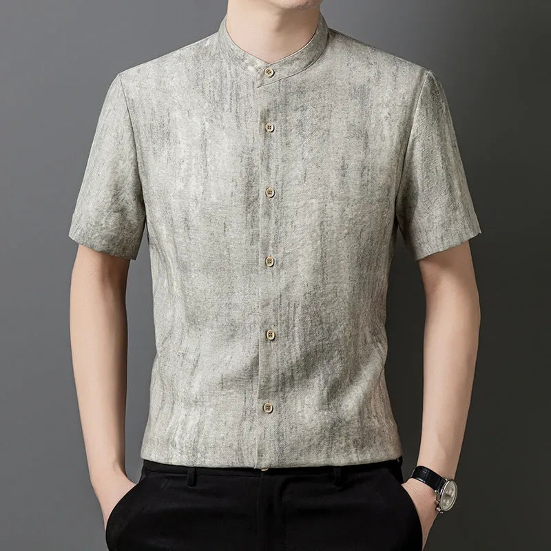 Men's loose grey linen shirt with stand collar, cardigan style, on a hanger.