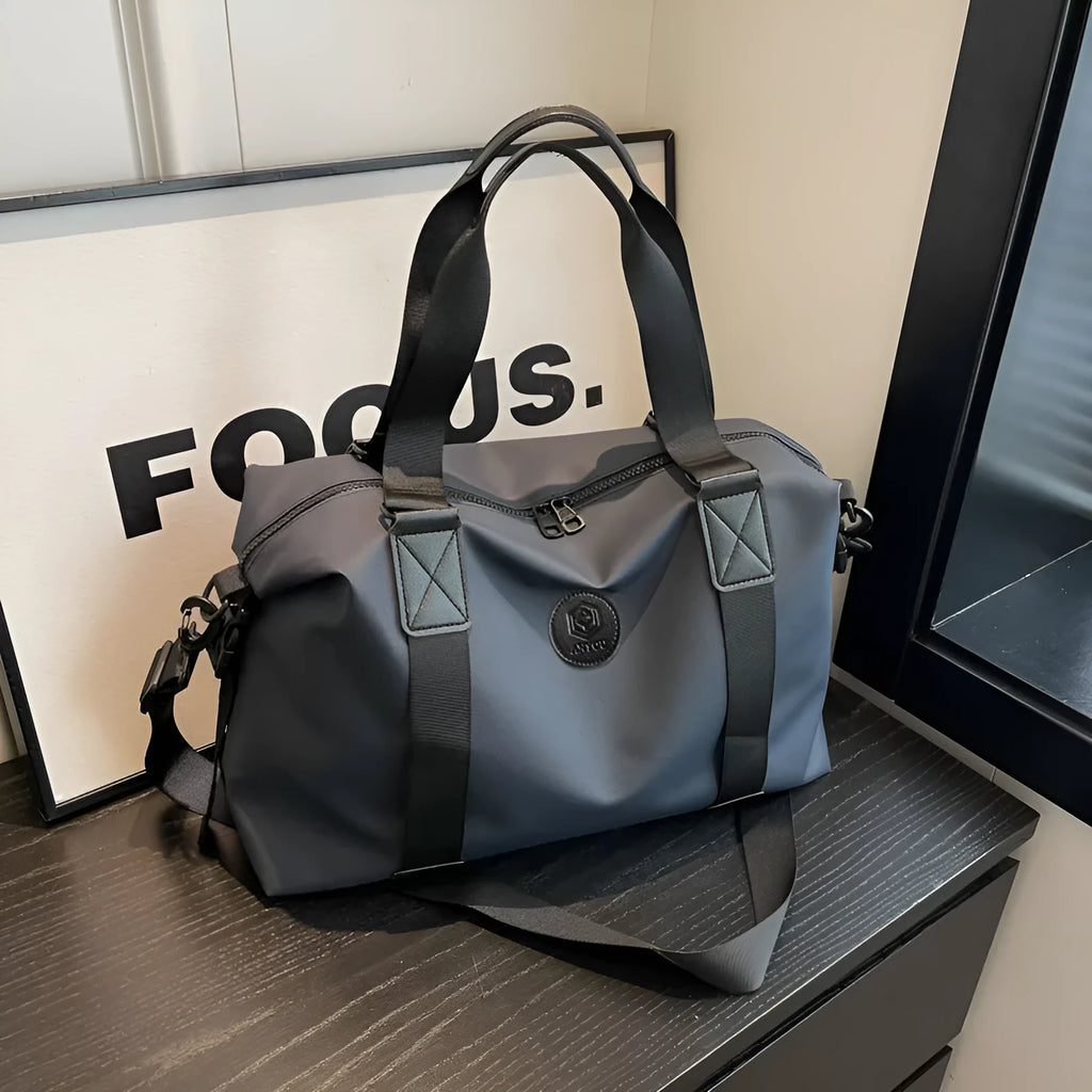 Large black travel rucksack made from Oxford cloth with breathable back padding and multiple compartments.