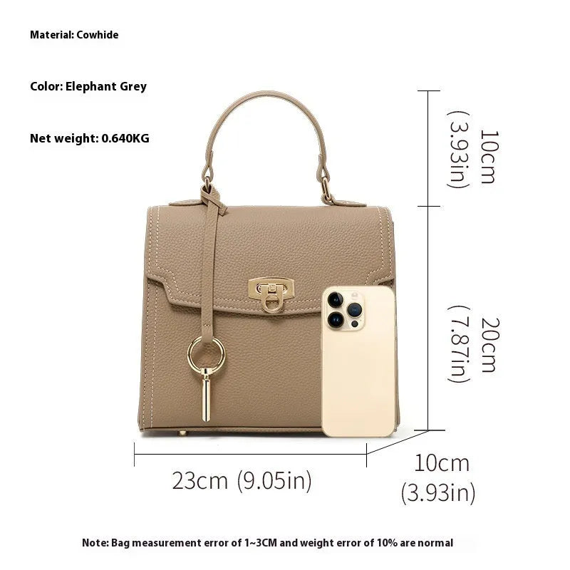 Elephant grey vintage handbag with lock closure and textured litchi pattern leather