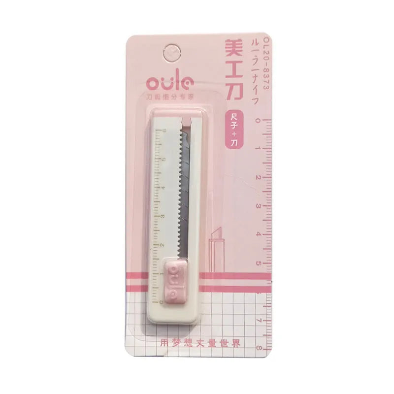 Small plastic blade art knife in blue, shown next to a ruler showing its 7.2cm length.