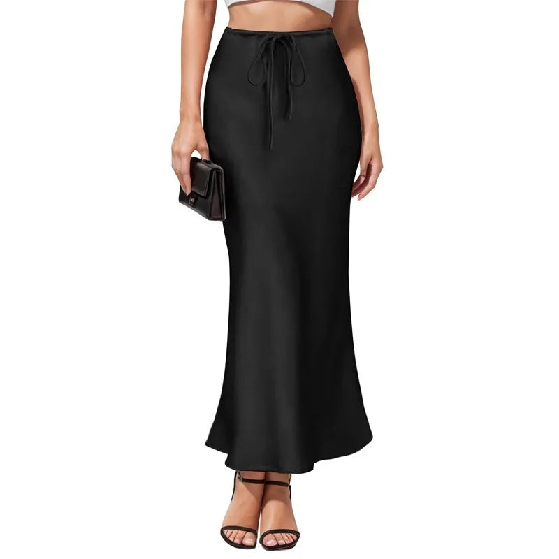 Women's high-waisted asymmetric acetate satin skirt in a solid colour with an irregular hemline.